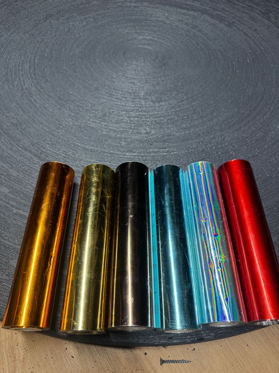 Metallic finish samples arranged in a spectrum of colours