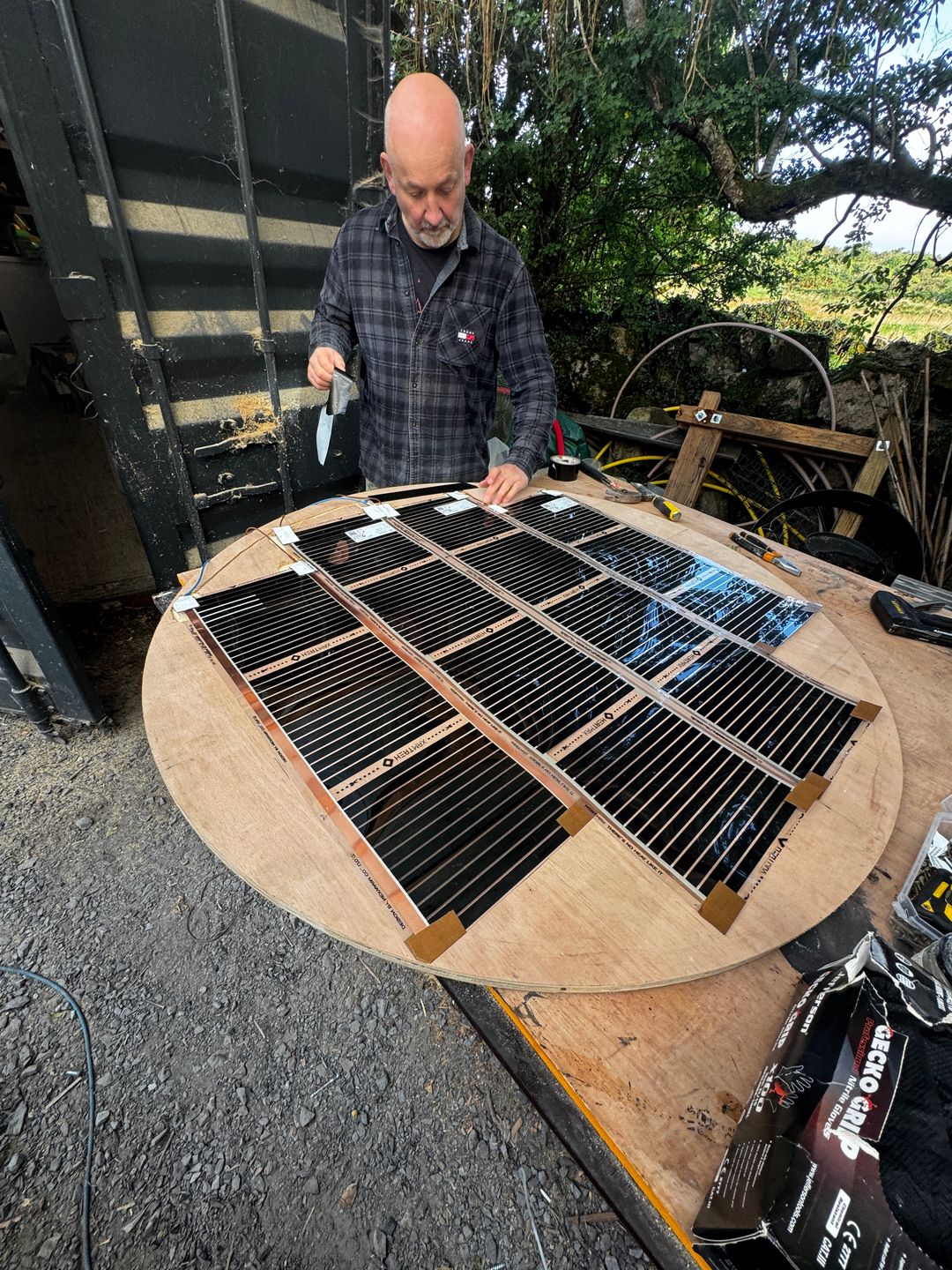 Josef working on the heating element of a circular panel