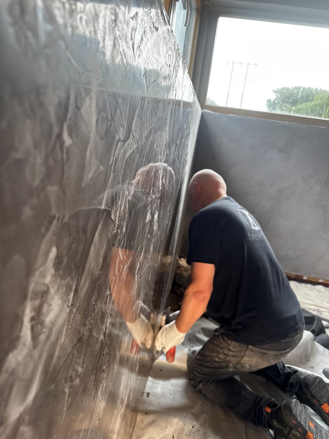 Finishing a textured heated wall on site